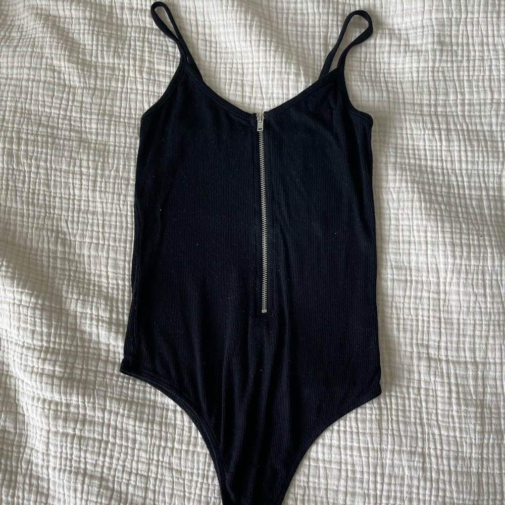 Black bodysuit with front zipper. Size s